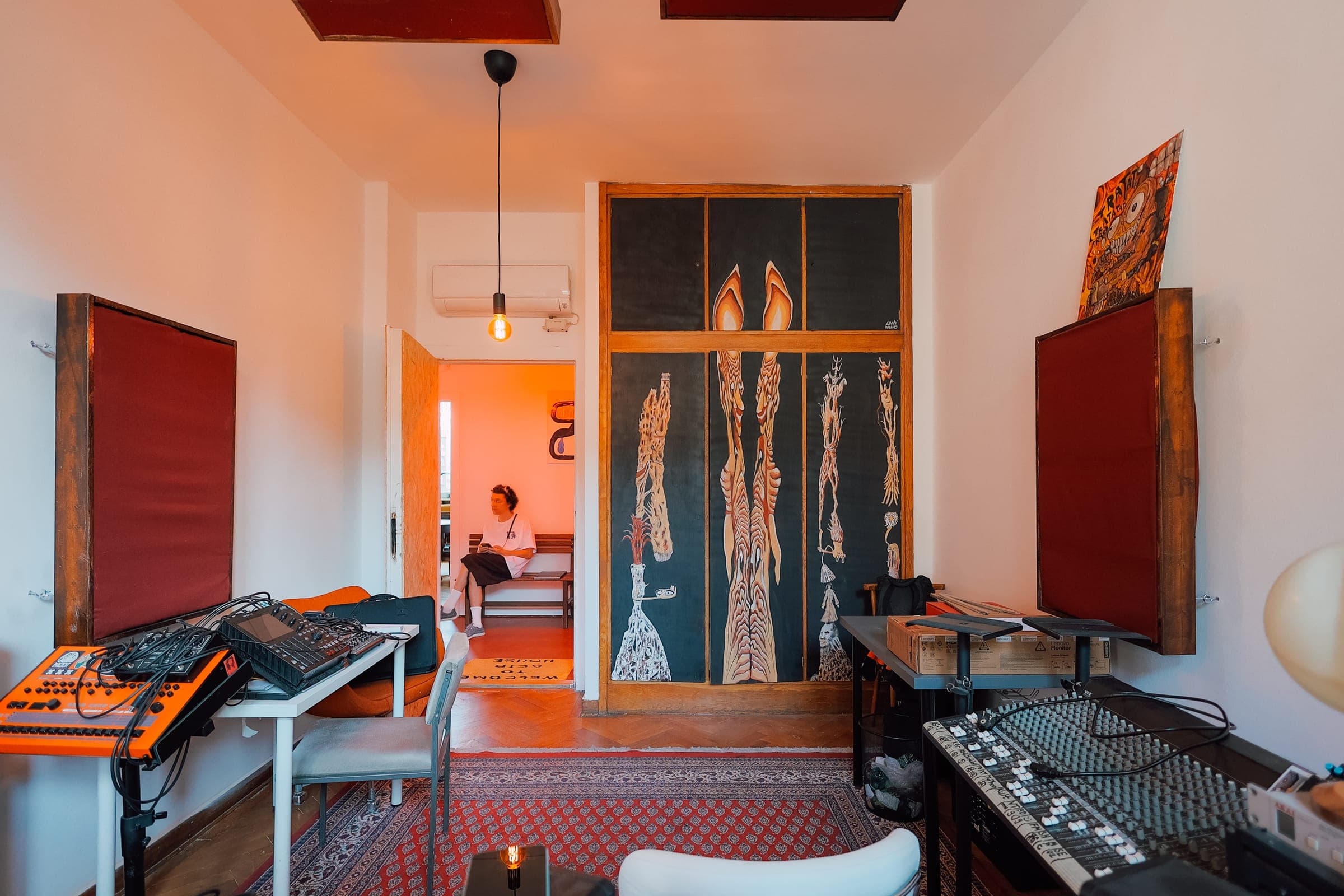 Music studio at SENSE—S.SPACE with synthesizers, mixing desk, and acoustic panels