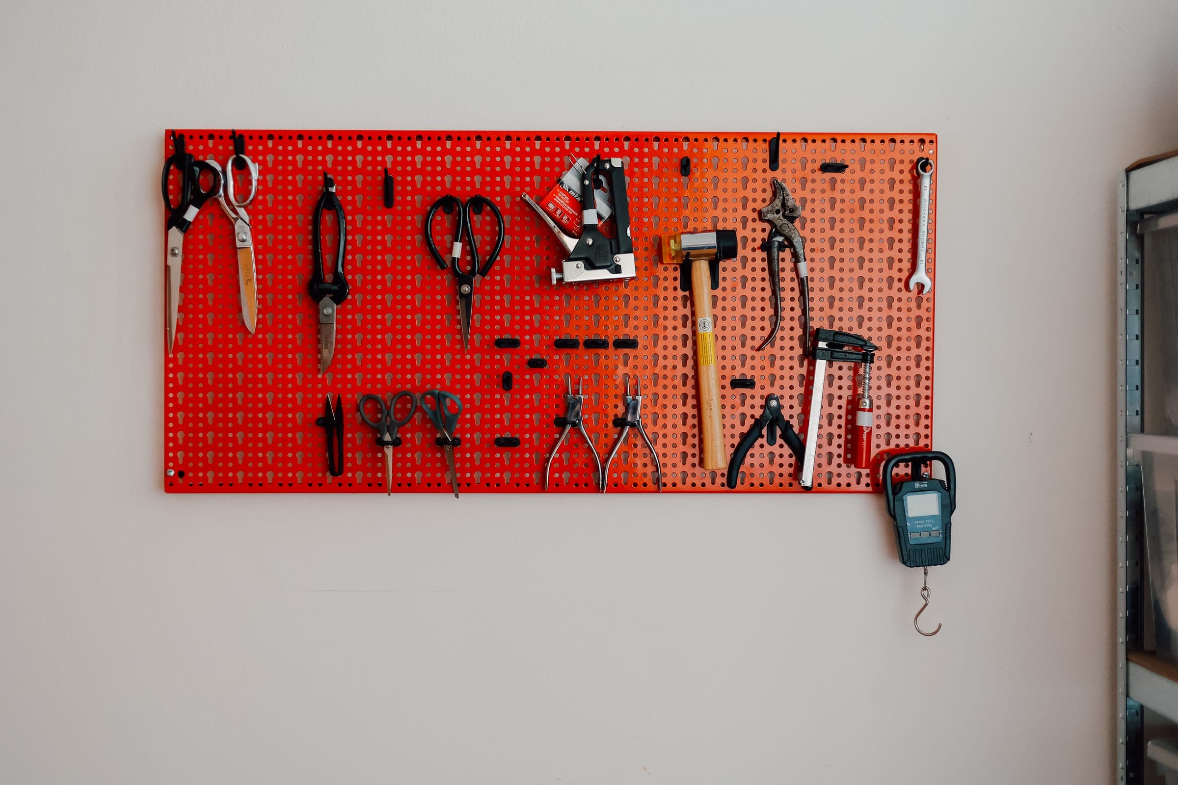 DIY workshop tool wall at SENSE—S.SPACE with organized scissors, pliers, and clamps